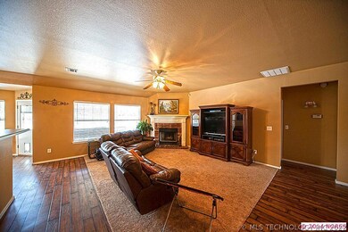 Cozy brick fireplace and wall of windows