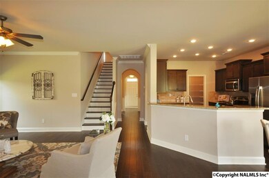 A classic plan with a modern, open twist!  Enjoy the open kitchen to the living without having your kitchen space open to everyone's view.
