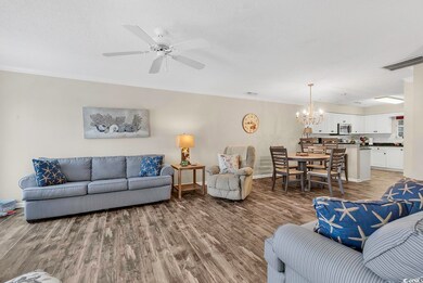 Living area featuring a textured ceiling, ceiling 