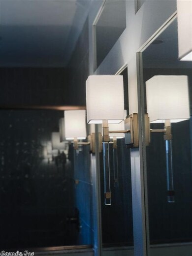Acrylic + Champagne Bronze Sconces set the TONE.