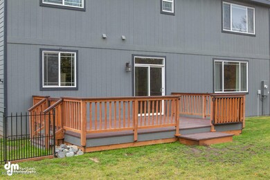 large deck, landscaped yard