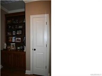 Built in book case and linen closet in hallway to 