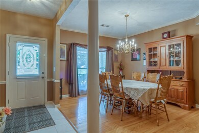 A chair rail accents the Foyer while the Dining Ro