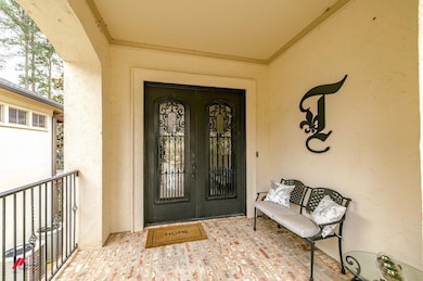 Doorway to property with stucco siding