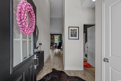 Foyer featuring light wood-type flooring and baseboards