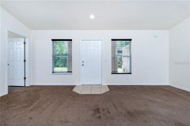 Greatroom facing front door with 2nd bedroom to th