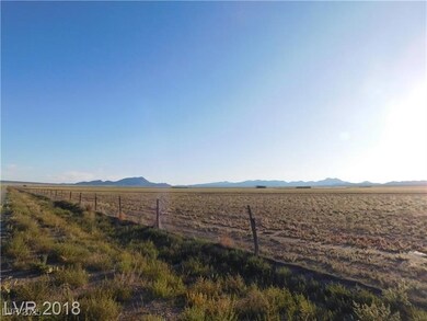 View of yard with fence, a rural view, and a mount