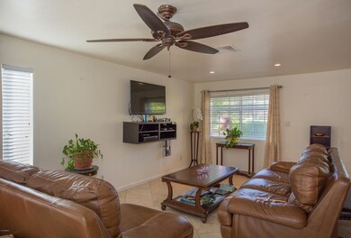 Living Rm with Neighborhood Views