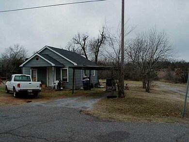 Exterior Front. On a corner.  2 lots, home sits on north lot.