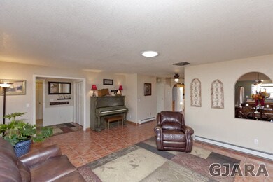 Flows into the Dining Room and Kitchen.