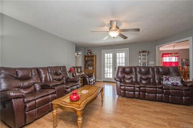 Spacious family room looking toward kitchen on the