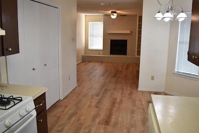 Kitchen with light wood-style floors, light count