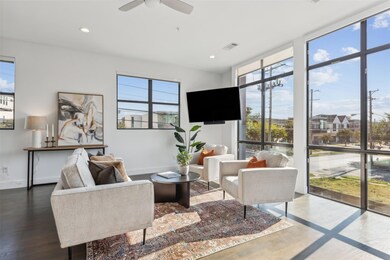 Living room with wood-type flooring and ceiling fa