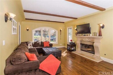 Living Room with wood burning fireplace and t.v.