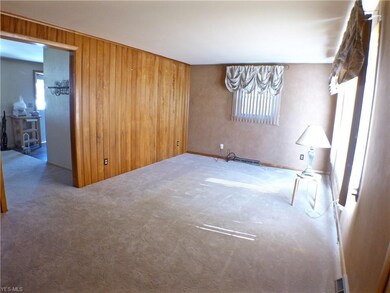 living room open to dining room, oak hardwood floo
