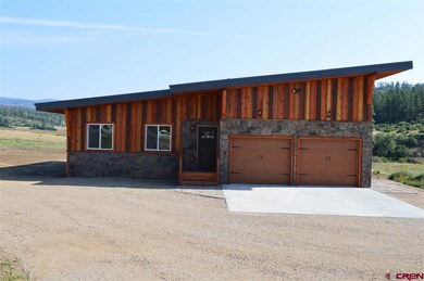 View of 2 car garage and entry way