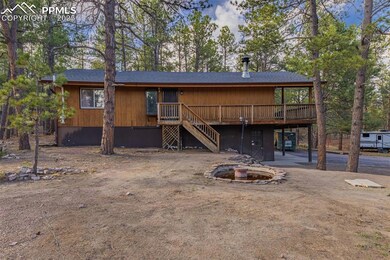 Rear view of property with stairway and a deck