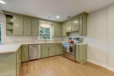 Industrial range and a window overlooking the yard will make your kitchen one of your favorite places in this house.