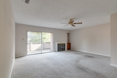 Unfurnished living room featuring a fireplace with