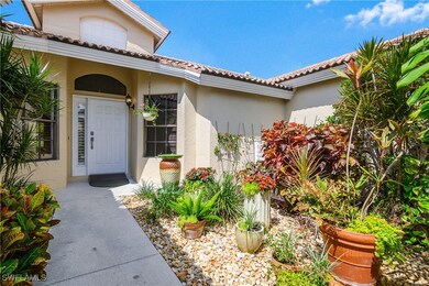 Property entrance featuring stucco siding and a ti