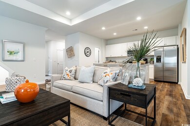 Living room with dark wood finished floors, recess