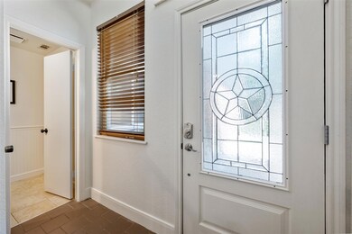 Entryway with plenty of natural light and a wains