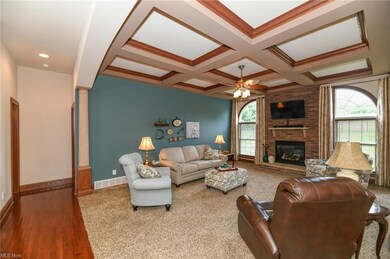 The hardwood floor leads back to the hall half bat