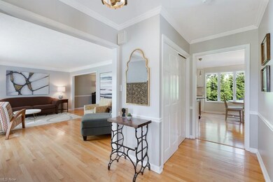 The welcoming foyer opens to the formal living roo