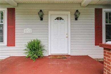 Covered cottage porch keeps you and your guests sheltered