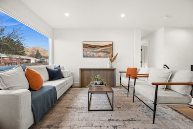 Living area featuring a mountain view, recessed lighting, and wood finished floors
