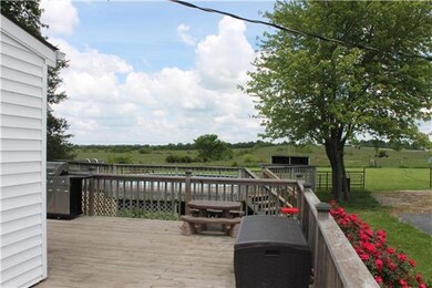 Wrap-Around Deck overlooking 20 acres. Fenced and 