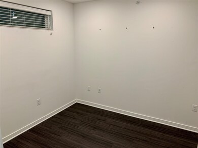 Unfurnished room with dark wood finished floors a