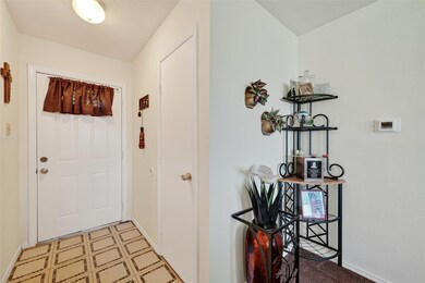 Entryway with baseboards and tile patterned floors
