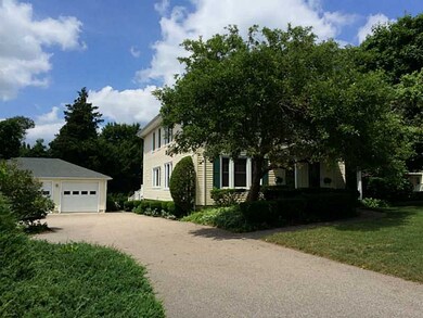 Exterior Front. driveway to 3 car garage and work