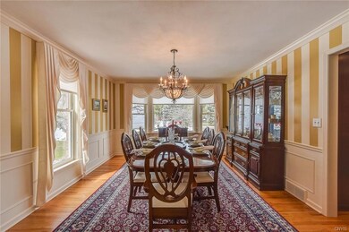 Large banquet size dining room with bay window and