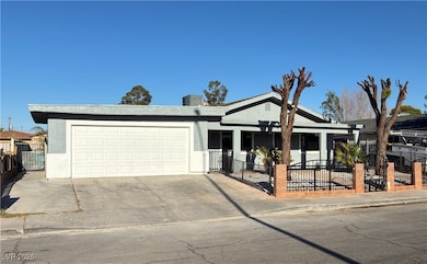 View of front facade with a garage, stucco siding,