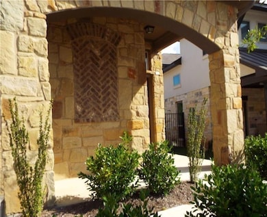Entrance to property with stone siding