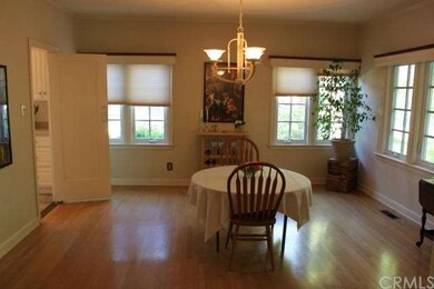 Formal dining room with hardwood floors and High-e