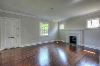 LIVING ROOM WITH BRICK FIREPLACE