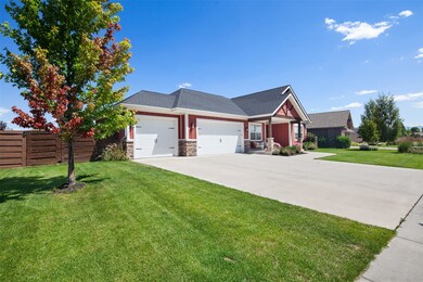 Ranch style house with a garage, concrete driveway