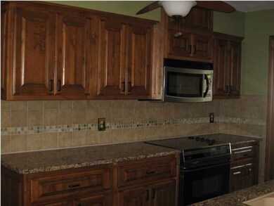 Kitchen granite counter top and tile back splash