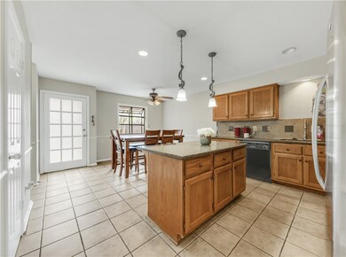 Kitchen featuring a sink, dishwasher, decorative b