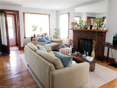 Living Room includes wood burning fireplace with gas logs currently being used.