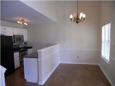 View of the dining area and kitchen.