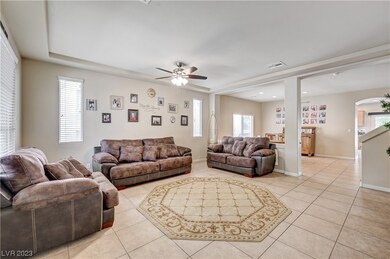 Formal Living Room with ceiling fan and tile floor