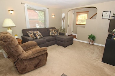 Another view of the living room with updated neutr