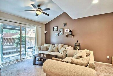 Living room with slider to fenced back patio 