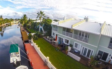 Unit with the orange umbrella is the townhouse for