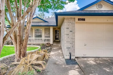 View of front facade featuring roof with shingles, brick siding, a porch, and an attached garage