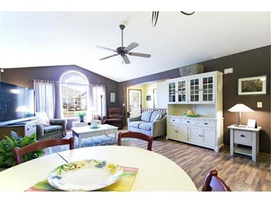Another view of the living room with a lot of natu